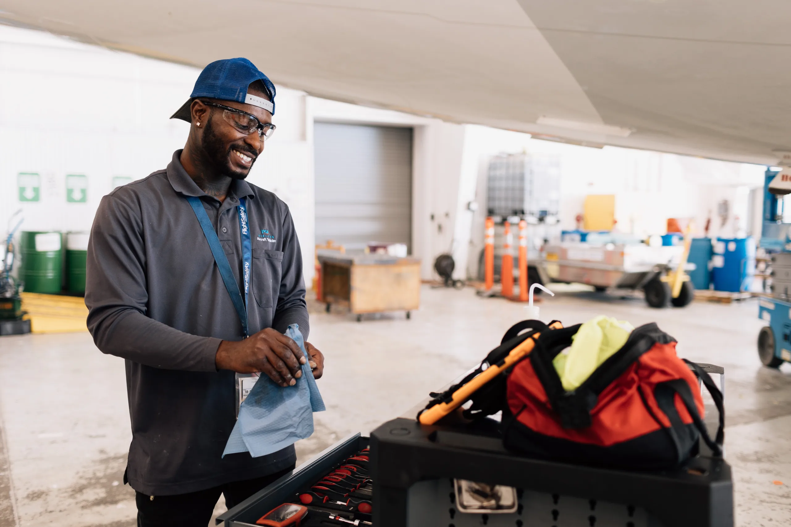 Man smiling and checking equipment